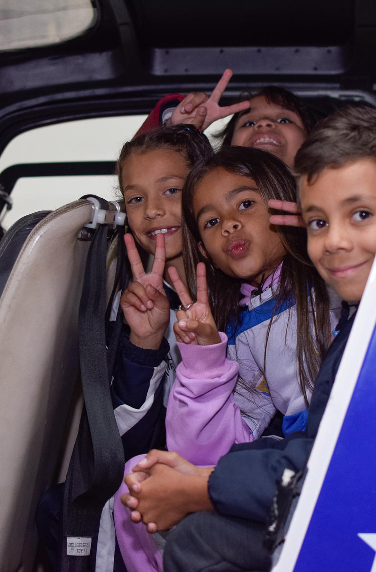 students smiling in a helicopter from a programme in Brasil with CIEDS NGO students smiling in a helicopter_CIEDS 2024